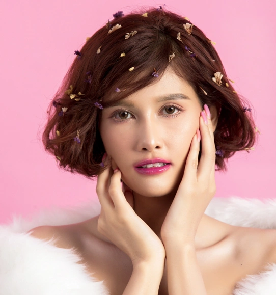 Beautiful asian woman isolated pink